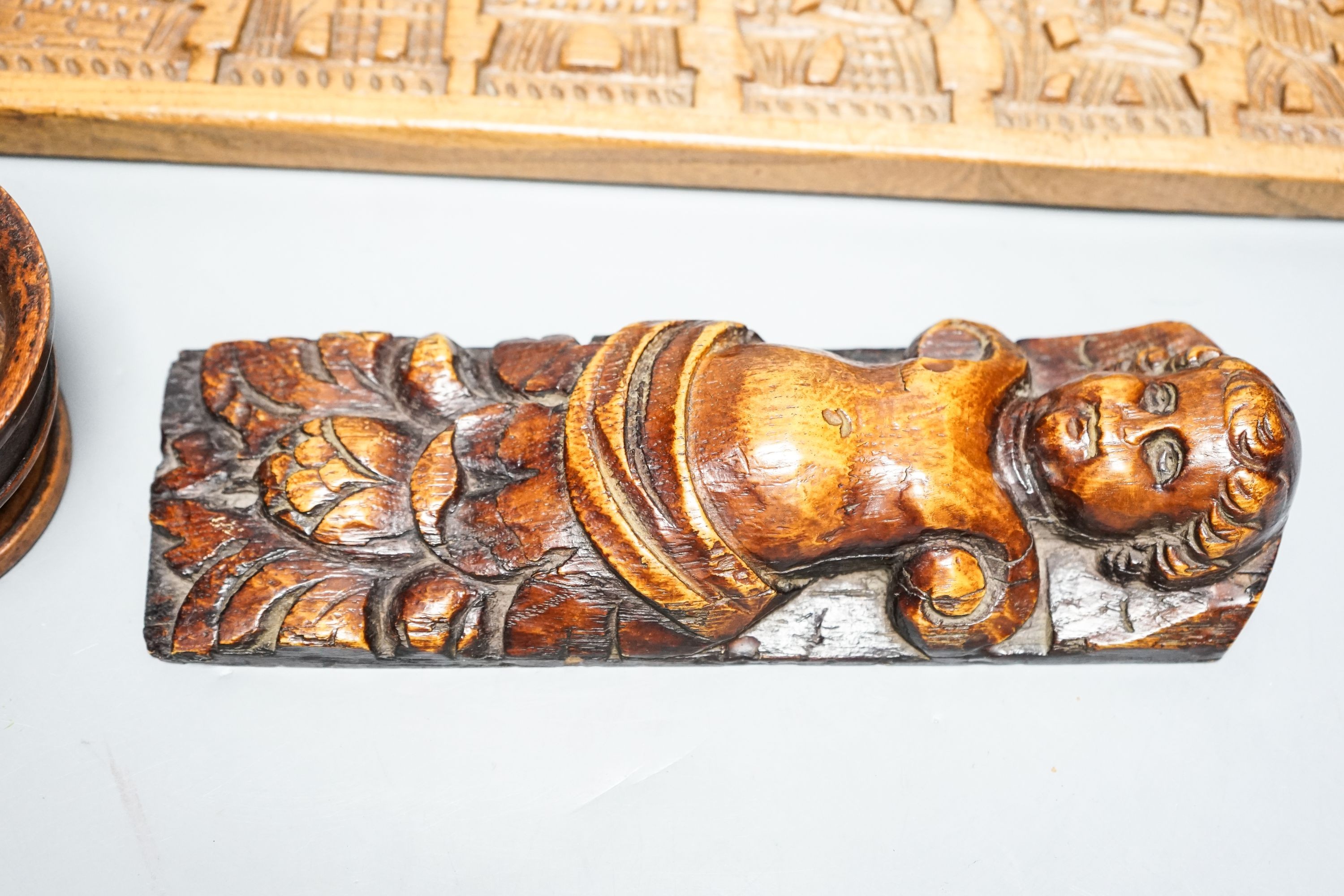 A 17th century carved oak caryatid terminal figure and two treen items 53cm